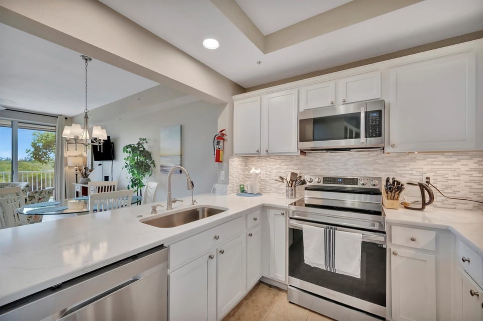 Bright kitchen counter with dishwasher and sink