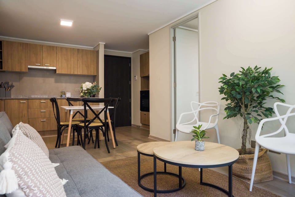 Cozy living and dining area with modern kitchen, perfect for relaxing and enjoying meals together.