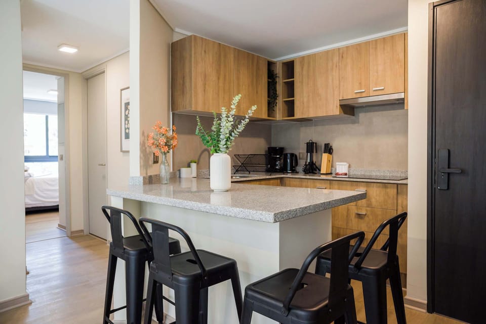 Stylish kitchen with modern amenities and a cozy breakfast bar, perfect for morning coffee or casual dining.