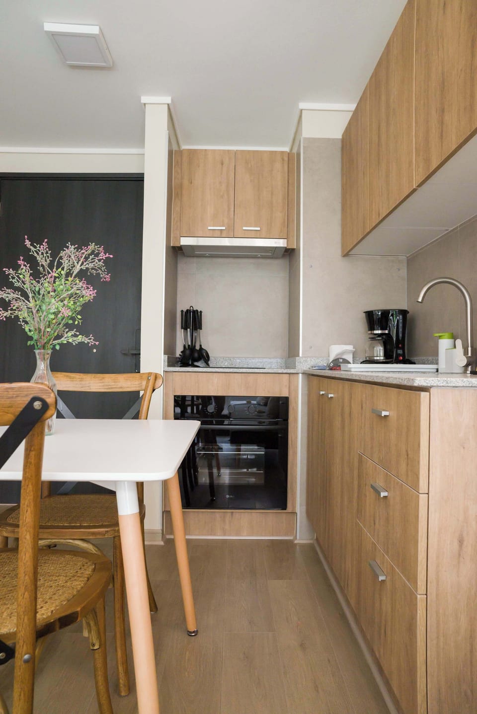 Cozy and efficient kitchen space with modern amenities, perfect for a quick meal or morning coffee.