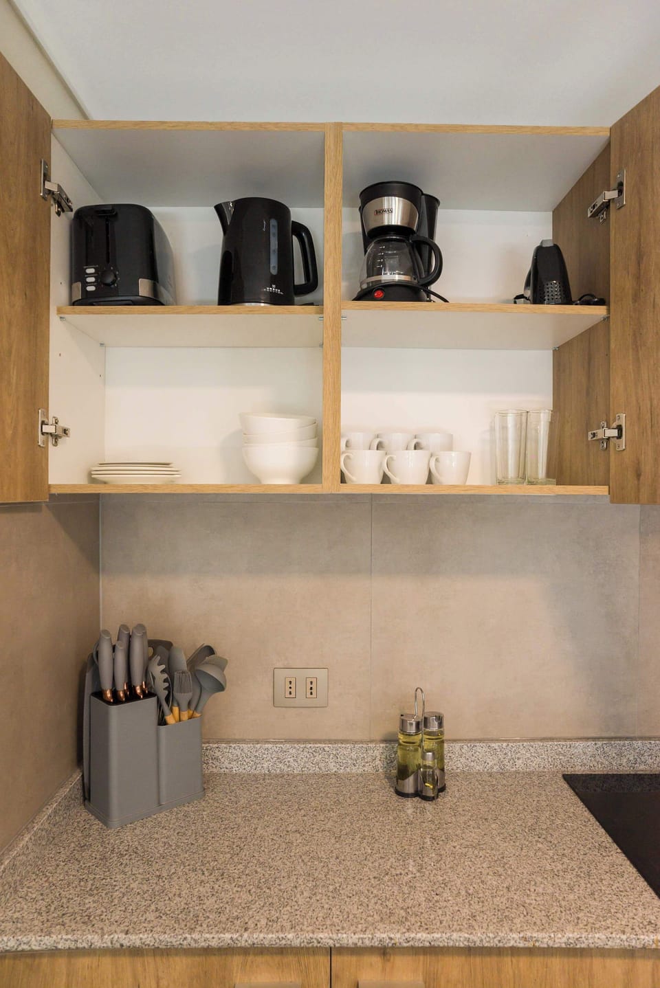 Fully equipped kitchen with modern appliances and ample storage for a convenient stay.