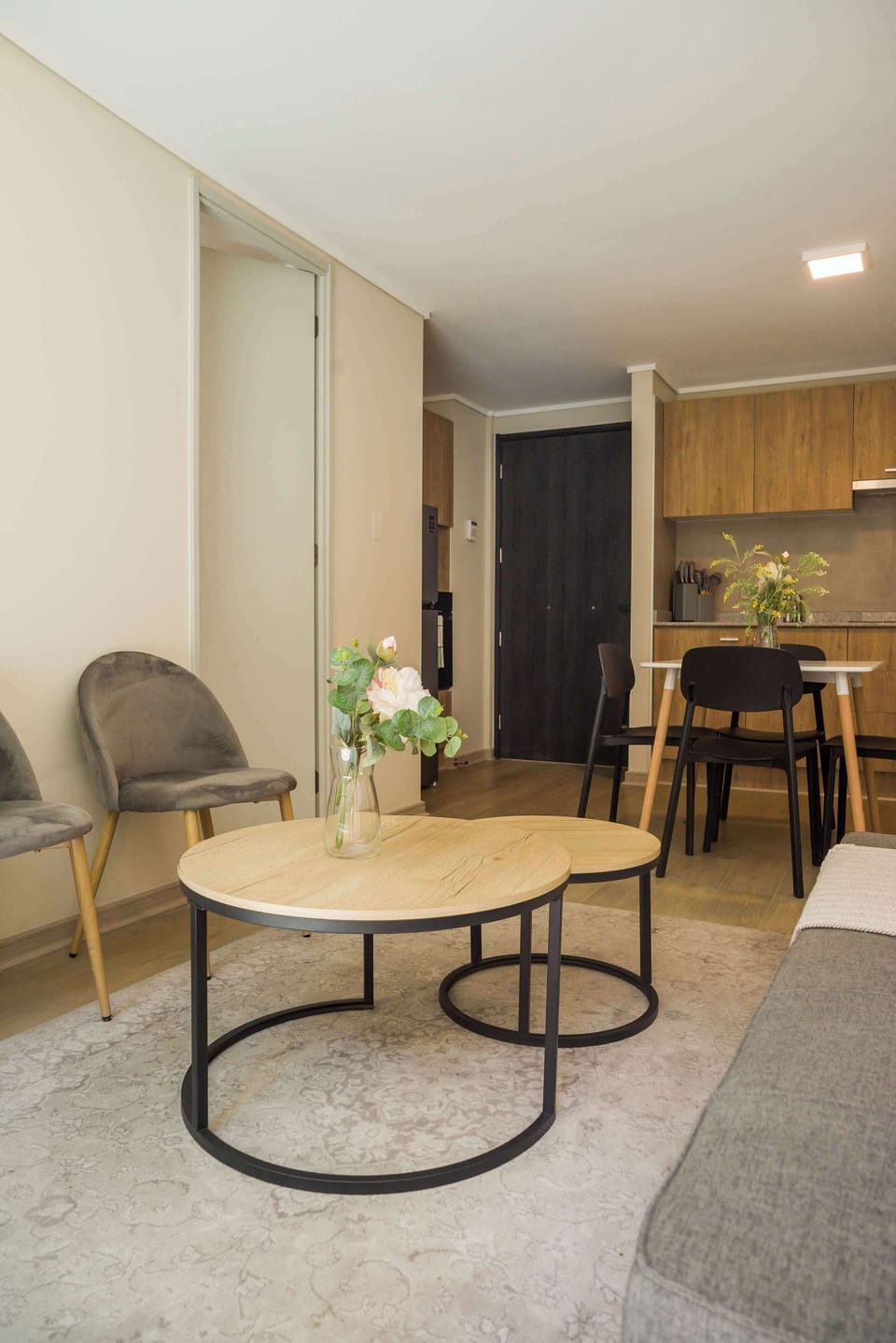 Cozy living space with modern decor and a welcoming dining area, perfect for relaxation and dining.