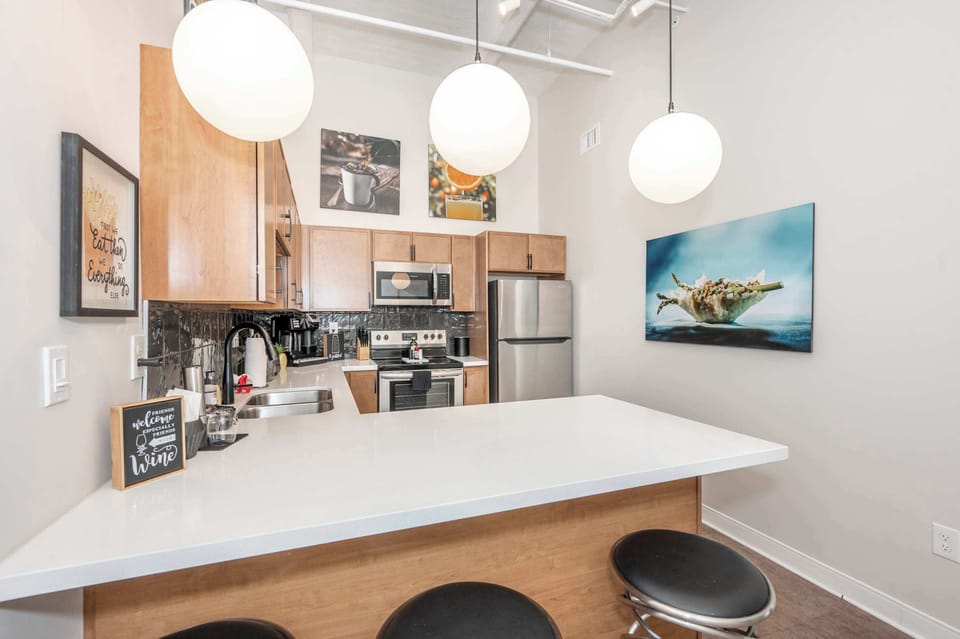 Suite 203’s open kitchen offers ample space & all the comforts of home​