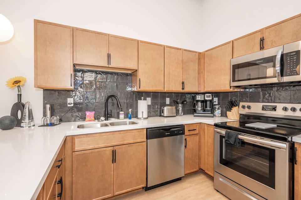 Suite 303’s inviting kitchen offers ample space & all the comforts of home​
