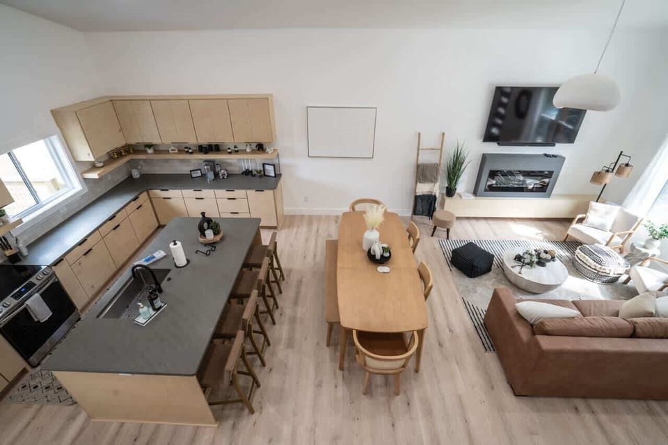 Elevated loft view overlooking the open-concept living and kitchen