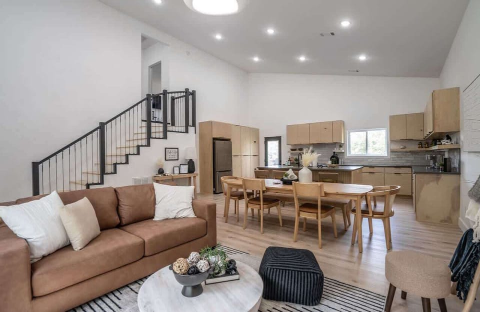 Designer kitchen with quartz countertops, stainless appliances, and breakfast bar