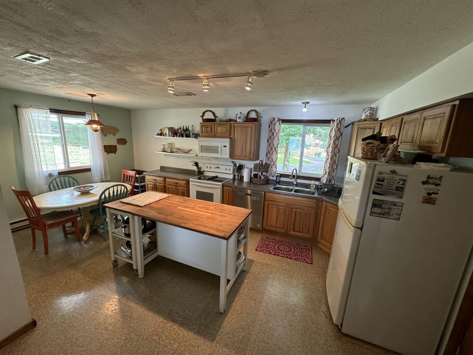 Fully stocked kitchen with dining area