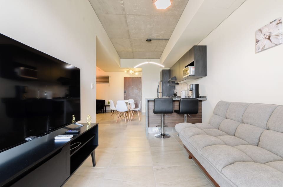 Classic Suite, Balcony, City View | Living area | 55-inch Smart TV with digital channels, streaming services