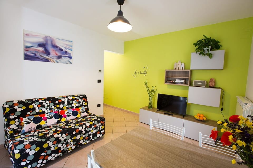 Apartment (SantOrsola apartment) | Living area | 42-inch flat-screen TV with cable channels