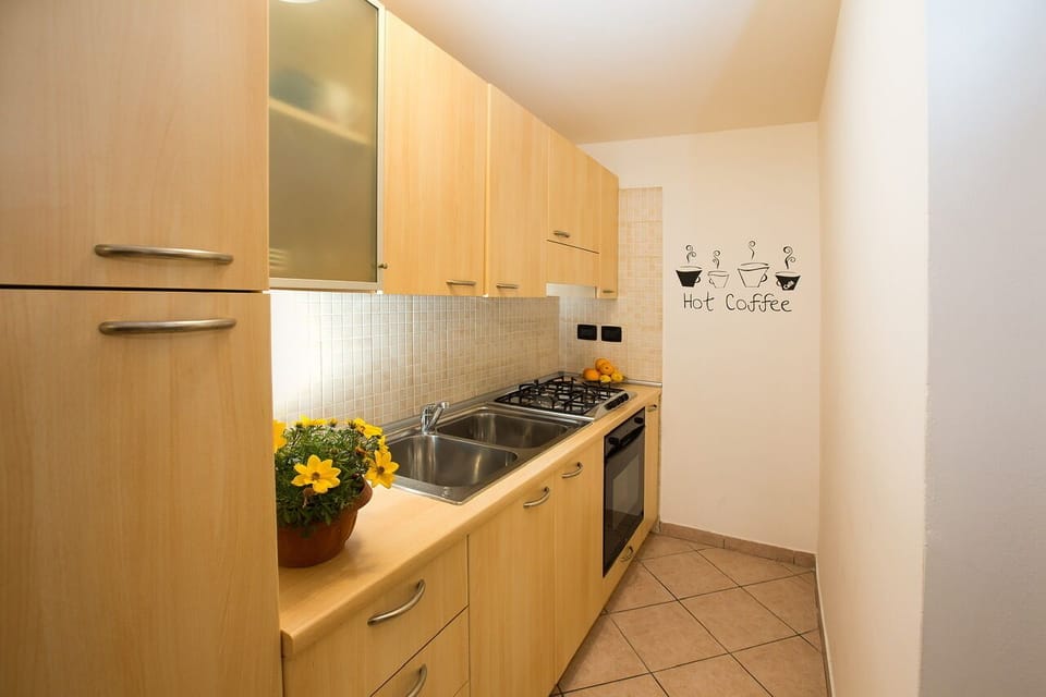 Apartment (SantOrsola apartment) | Private kitchen | Full-size fridge, oven, stovetop, espresso maker