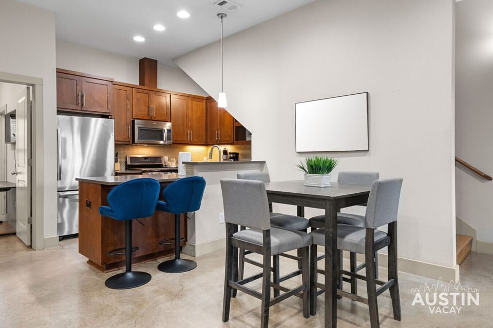 Island seating for two plus a dedicated dining table for four