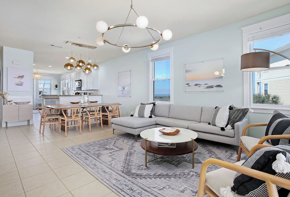 Enjoy the 77-inch smart TV in the living room with views facing the beach.