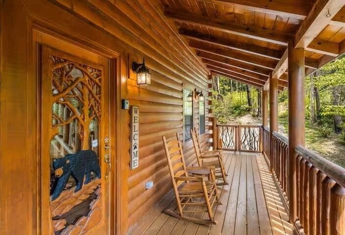 Beautiful front porch offering views of the surrounding woods.