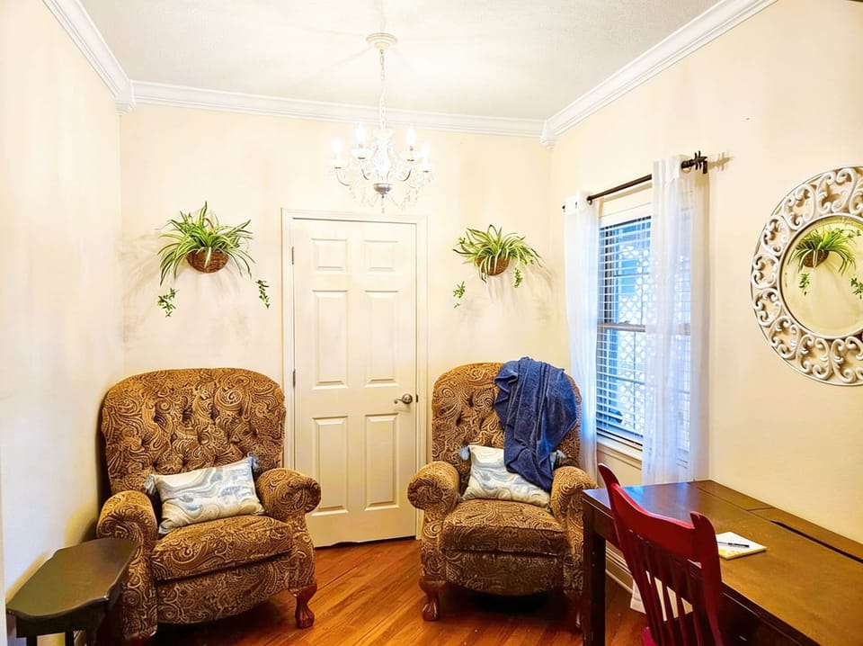 Back Porch Parlor/Dedicated Office Area with privacy door complete with recliners and charging ports