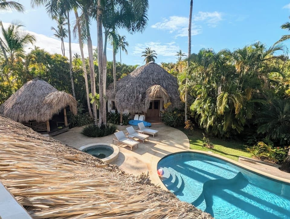 View of pool, hot tub, 4 person bungalow, and eating gazebo from the master bedroom balcony