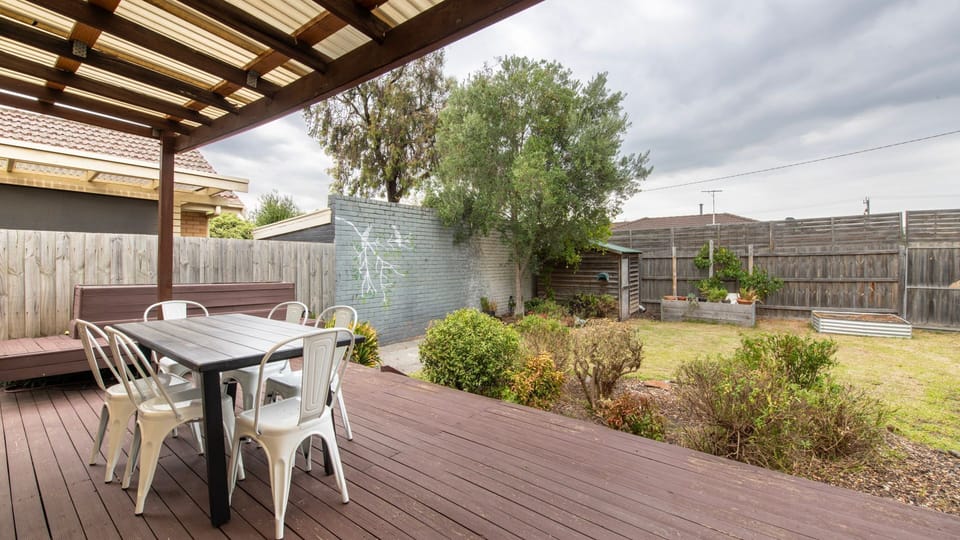 Outdoor dining deck with garden views