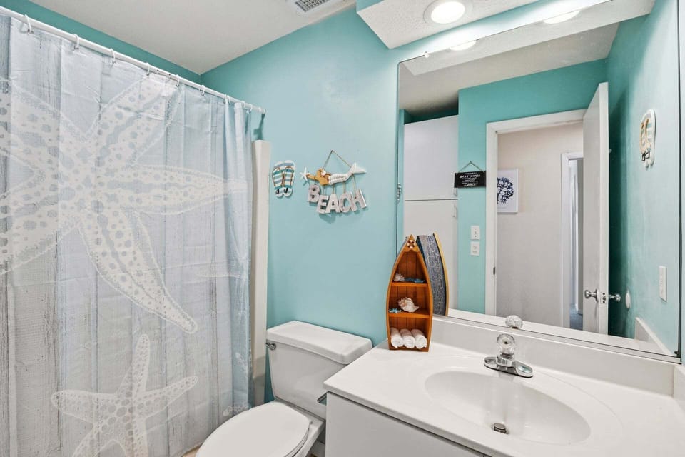 Full hallway bathroom on top level for shared convenience.