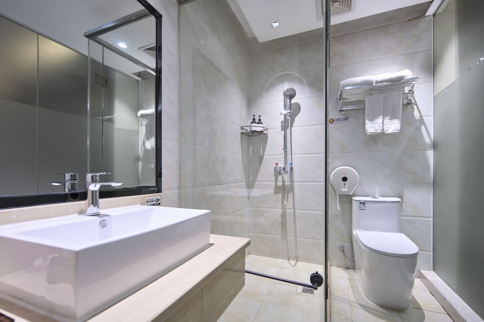 Shower, free toiletries, hair dryer, slippers