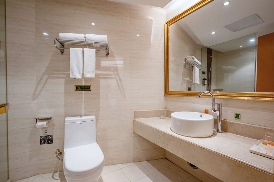 Shower, hair dryer, slippers, towels