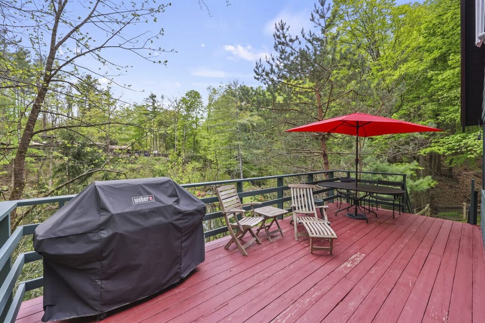 Sip your morning coffee on the spacious deck with serene forest views.