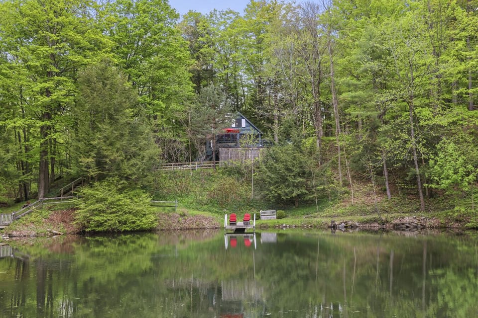 Stunning wide views of the pond and surrounding forest landscape.