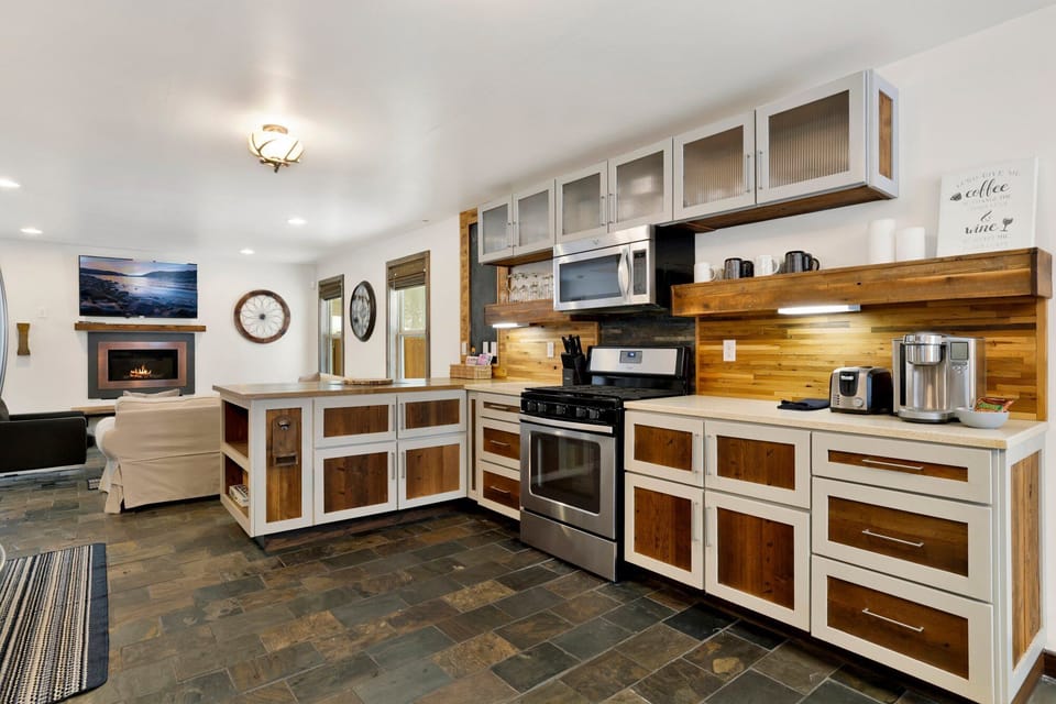 Functional cabin kitchen with modern appliances, perfect for home-style cooking.