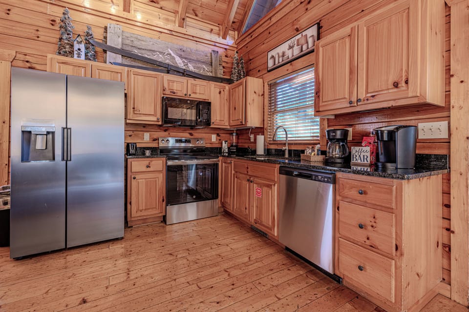 Modern kitchen with stainless steel appliances and comfort essentials