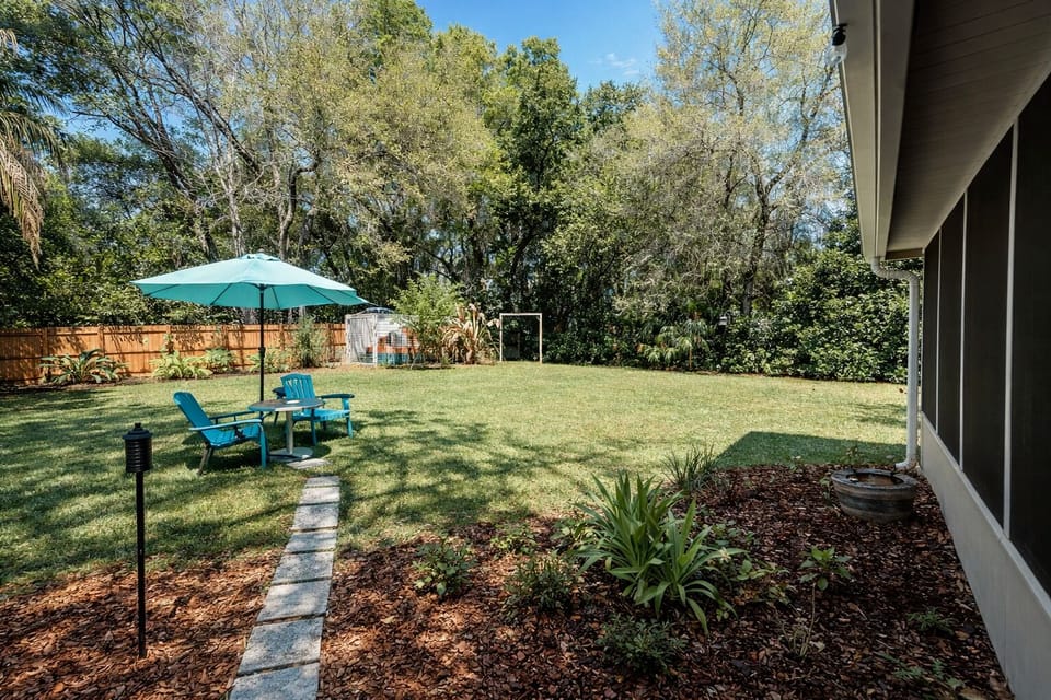 Spacious fenced backyard perfect for relaxing, letting pets roam,