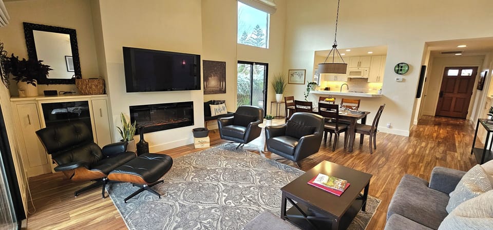 Open concept dining and living rooms.