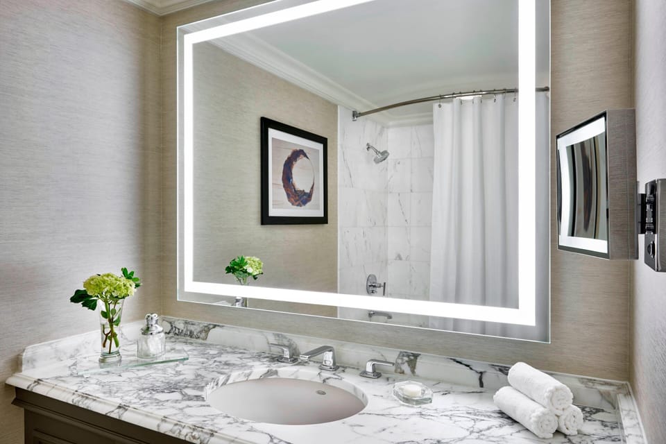 Designer toiletries, hair dryer, bathrobes, towels
