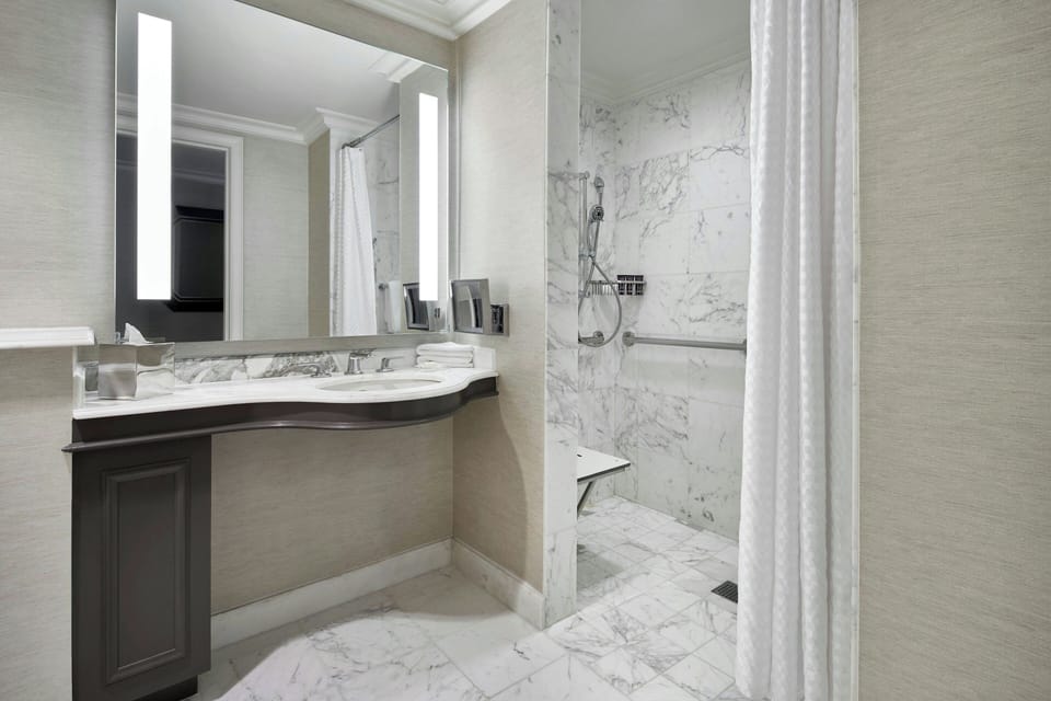 Designer toiletries, hair dryer, bathrobes, towels