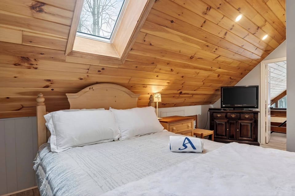 Loft room with queen-sized bed.