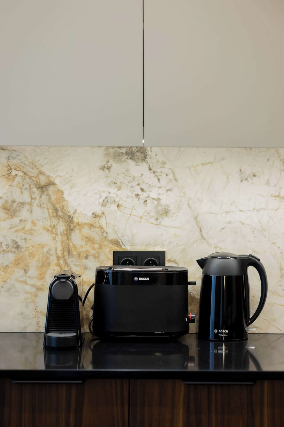 Close-up of kitchen appliances. An electric kettle, coffee maker and toaster allow you to prepare a delicious breakfast.