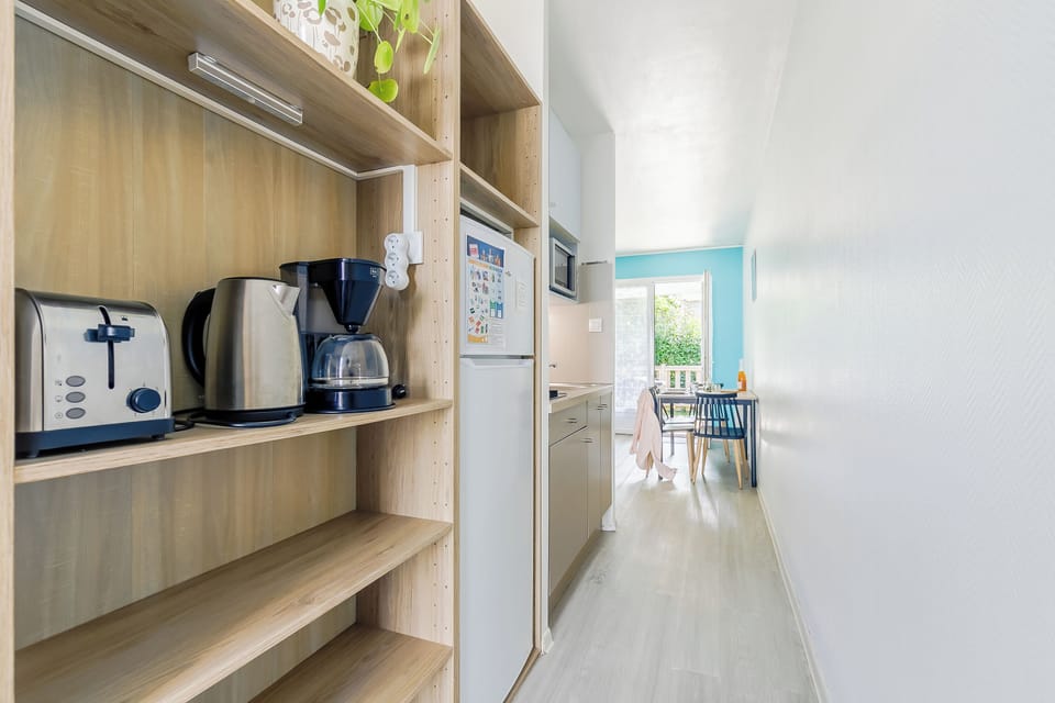 Comfort Chalet | Private kitchenette | Microwave, highchair, eco-friendly cleaning products, dining tables