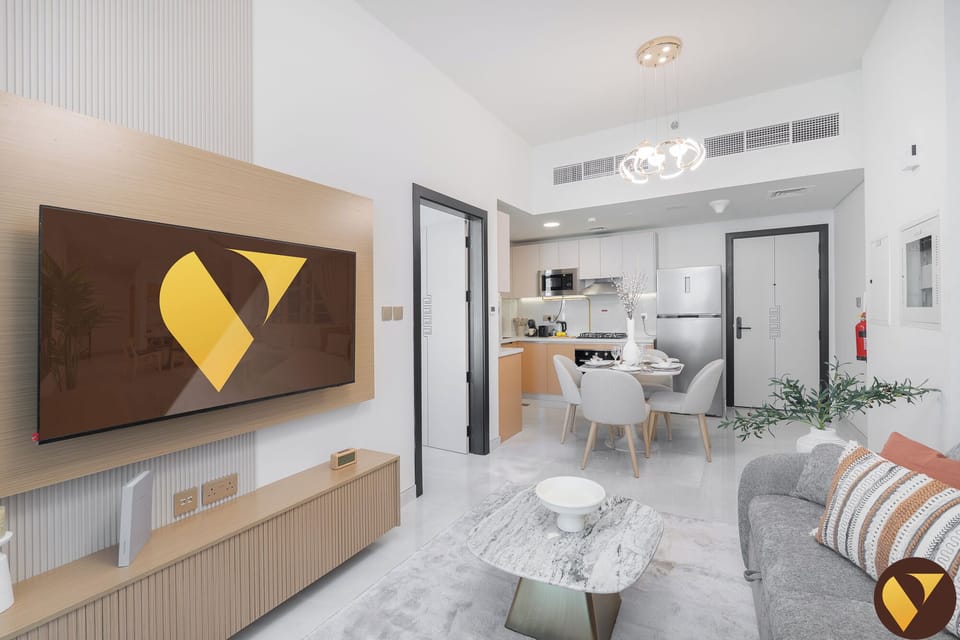 Standard Apartment, 1 King Bed with Sofa bed, Balcony, City View | Living room | 65-inch Smart TV with cable channels