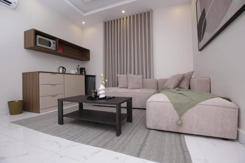 Deluxe Apartment, Non Smoking, Private Bathroom | Living area | 32-inch LED TV with satellite channels