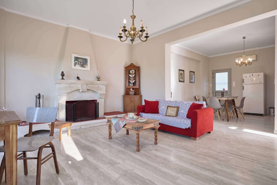 Cozy living room with a vibrant sofa and plenty of natural light to unwind