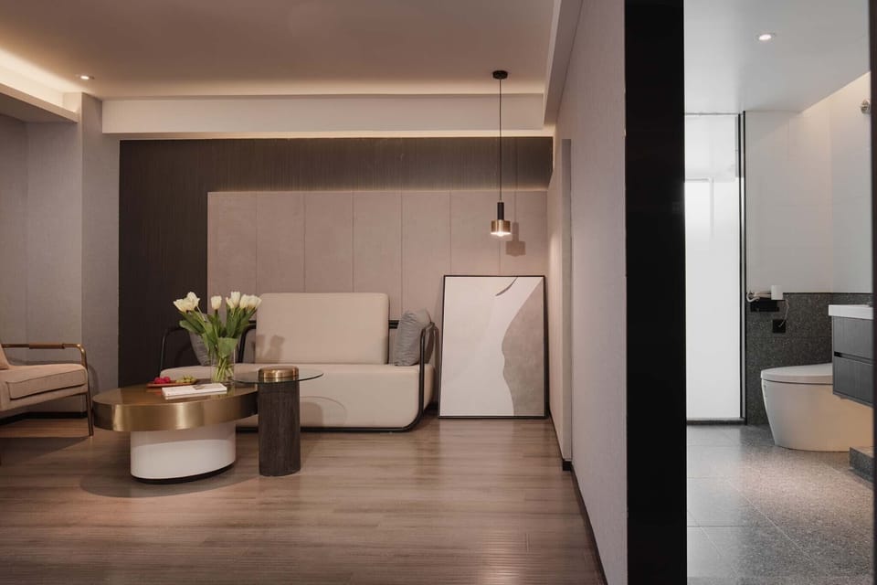 Family Suite, Balcony, City View | Living room | 50-inch TV with cable channels