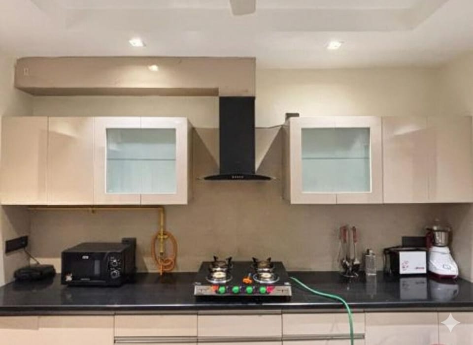 Apartment, Balcony, Garden View | Private kitchen | Toaster, dining tables