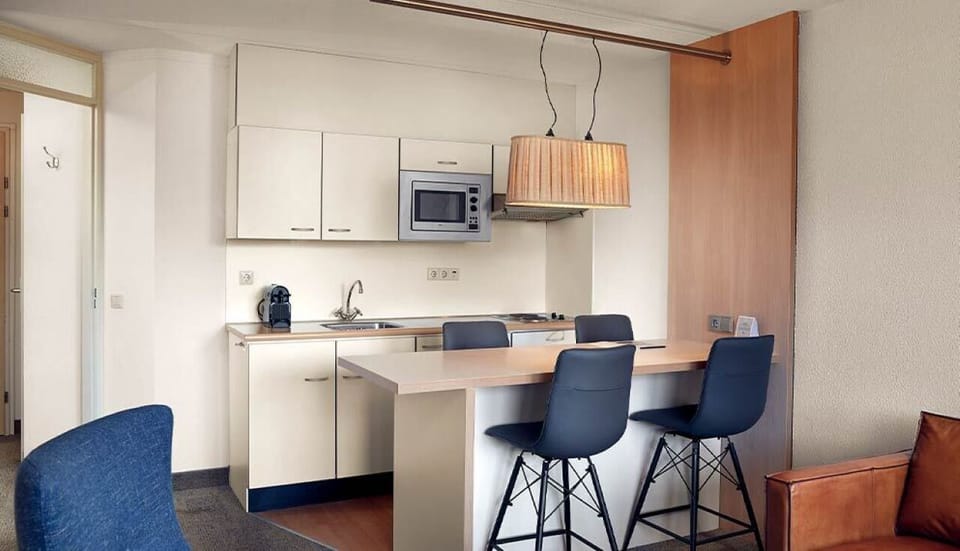 Whip up quick meals in this sleek, compact kitchenette.
