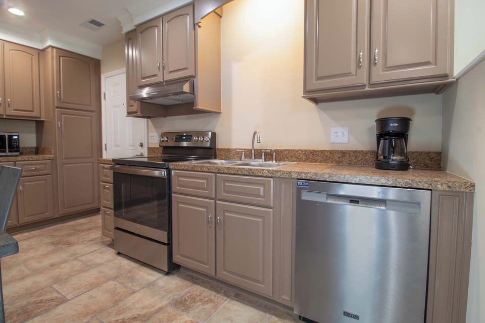 Your fully equipped kitchen awaits with granite counters, stainless appliances, and coffee maker for perfect vacation mornings.