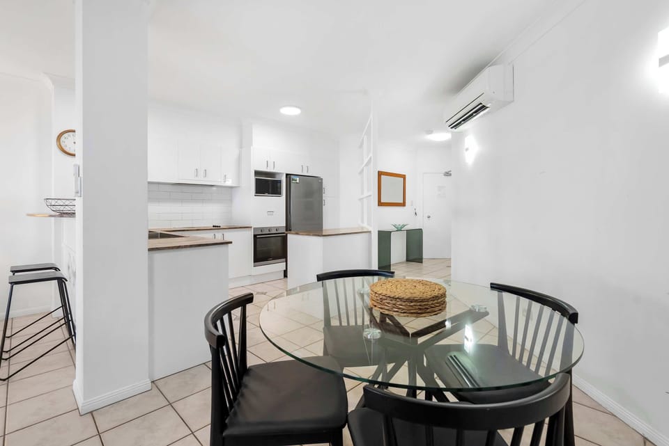 Experience the joy of cooking and dining in this stylish open-plan kitchen and dining area.