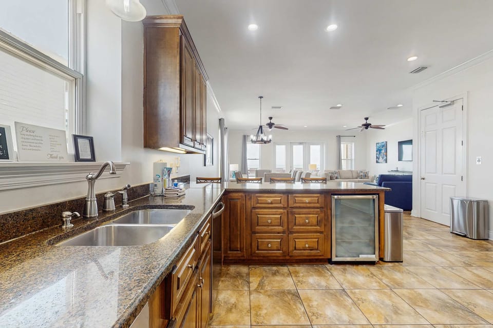 Open concept kitchen with under-counter ice maker and large double sink
