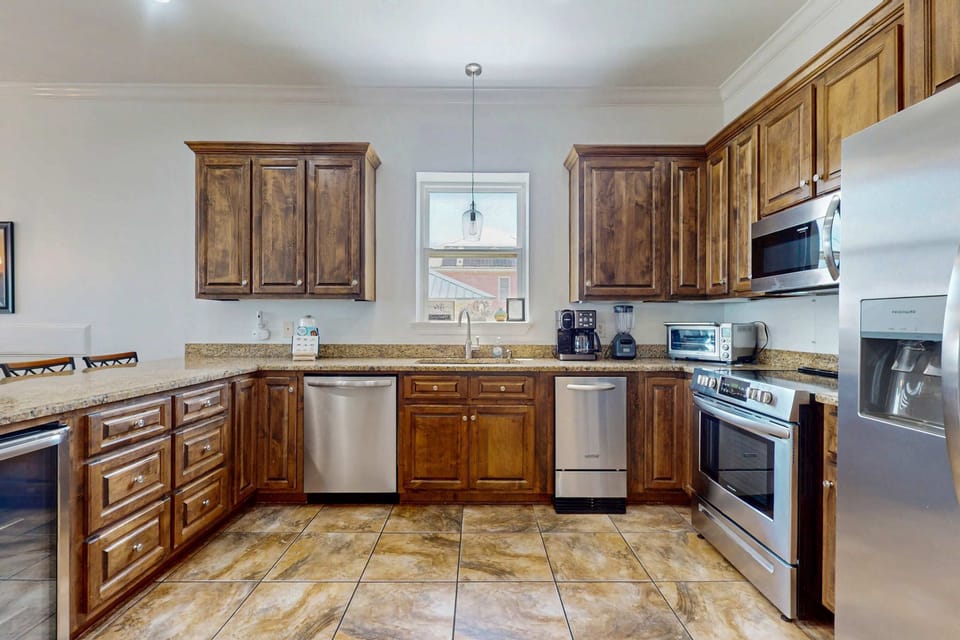 Spacious kitchen with stainless steel appliances and plenty of storage space