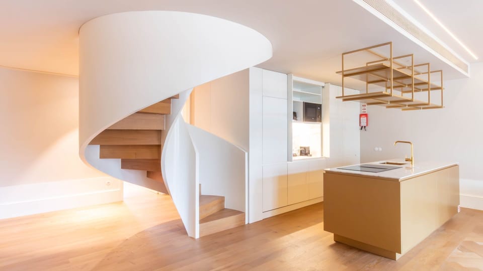 Architectural charm meets contemporary design — from the sculptural staircase to the sleek kitchen.

#LovelyStay #ModernLiving #PortoApartments #DesignLovers