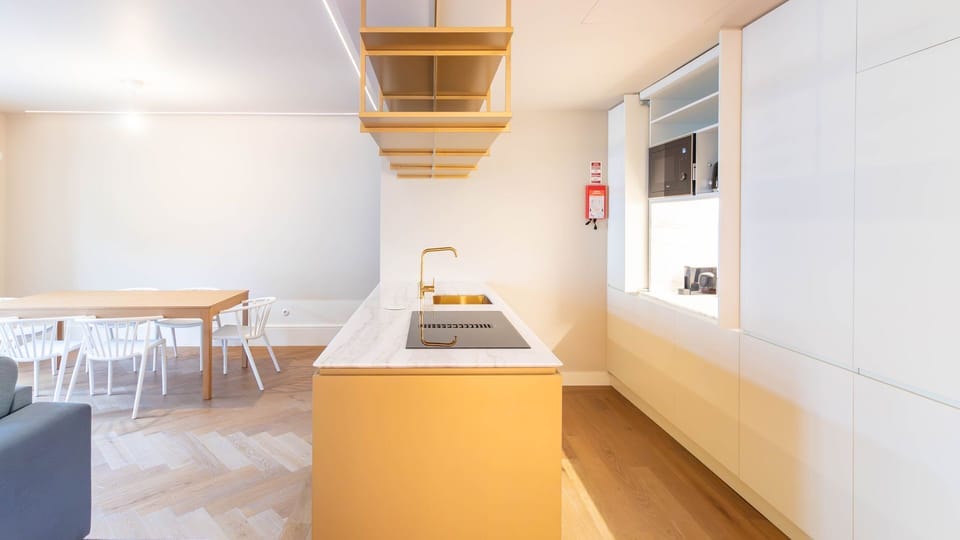 A sleek designer kitchen with marble countertops and elegant gold accents, perfect for slow mornings or dinner at home.

#ModernKitchen #InteriorDesign #LuxuryLiving #HolidayApartment