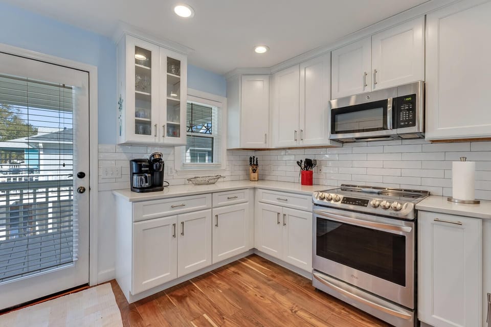 Bright, fully equipped kitchen with modern appliances and plenty of counter space for preparing your favorite meals during your stay.