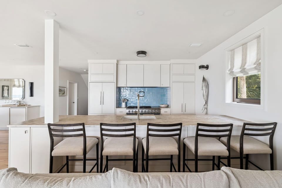 Gather around your spacious kitchen island with five comfortable bar stools, perfect for morning coffee or casual meals together.