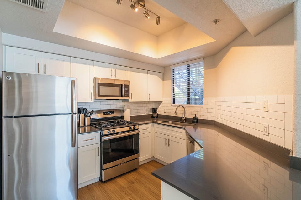 Double Room, 2 Queen Beds, Non Smoking | Private kitchen | Full-size fridge, microwave, oven, stovetop
