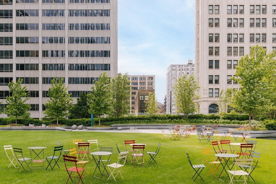 Outdoor green space in the heart of downtown, perfect for relaxing or enjoying a break between exploring the city.

